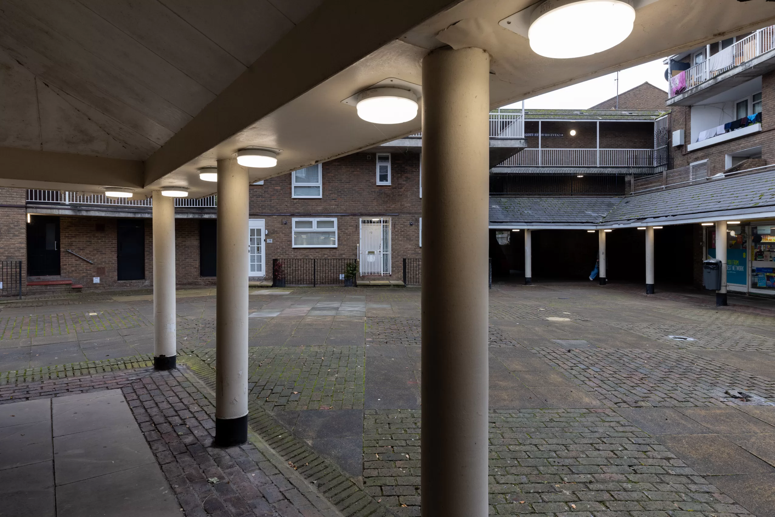 NIMROD in a courtyard with shops and flats